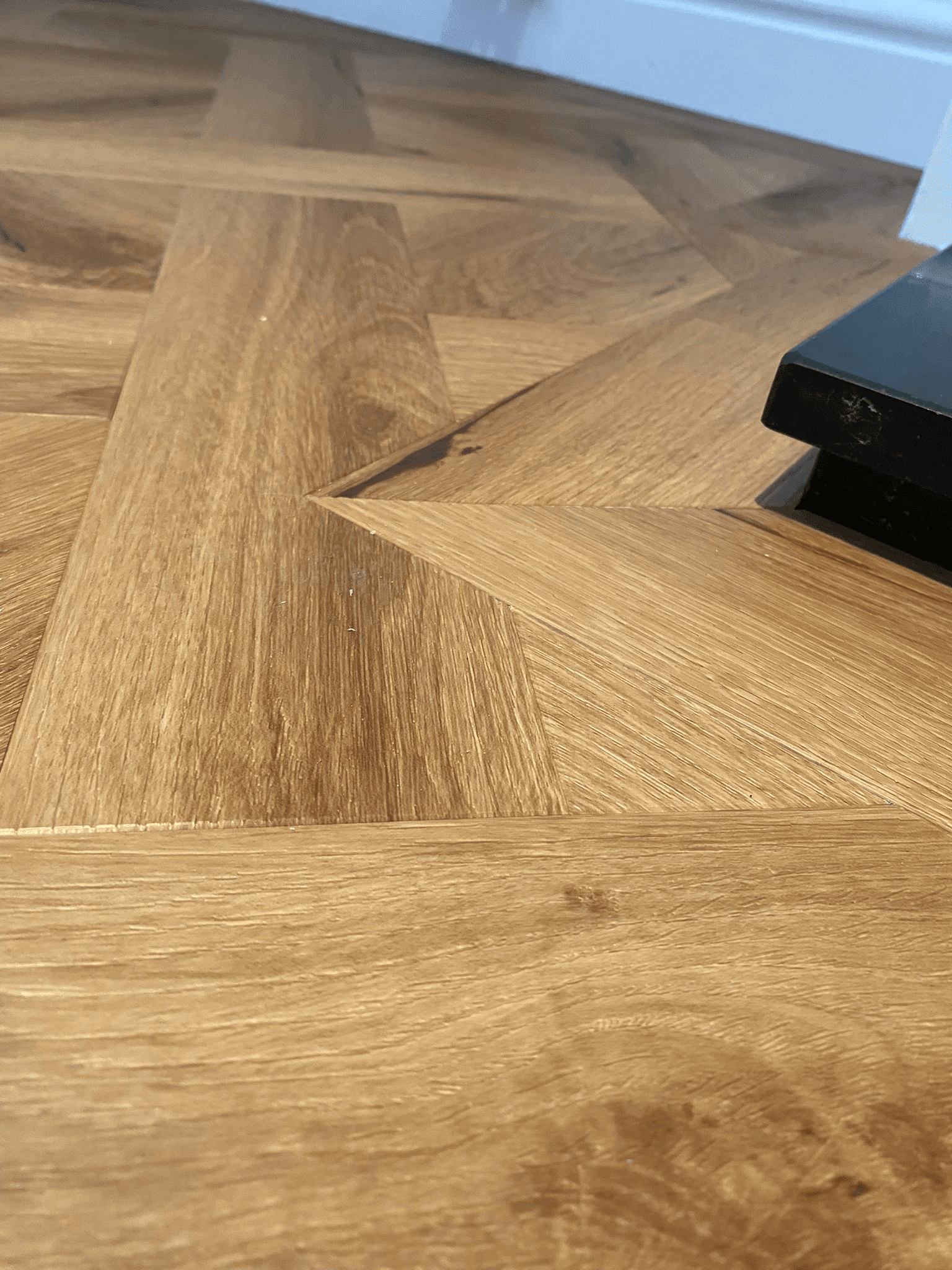 Warm oak herringbone parquet flooring