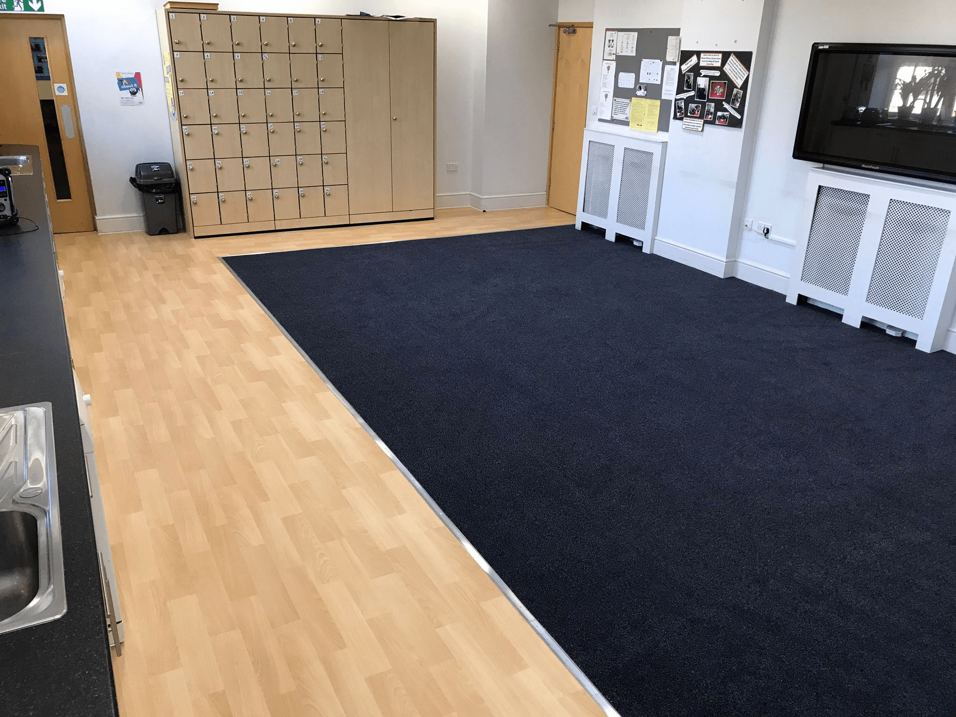 Commercial carpet and vinyl flooring in a school common room